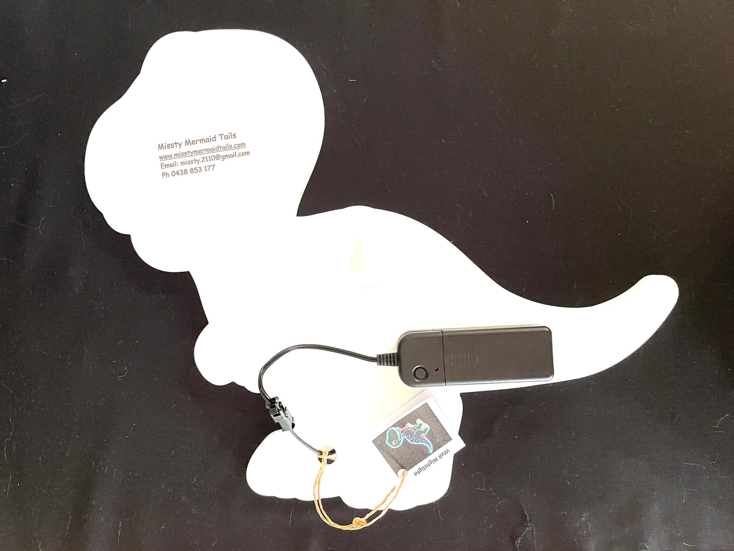 Back view of T-Rex dinosaur neon light with battery pack