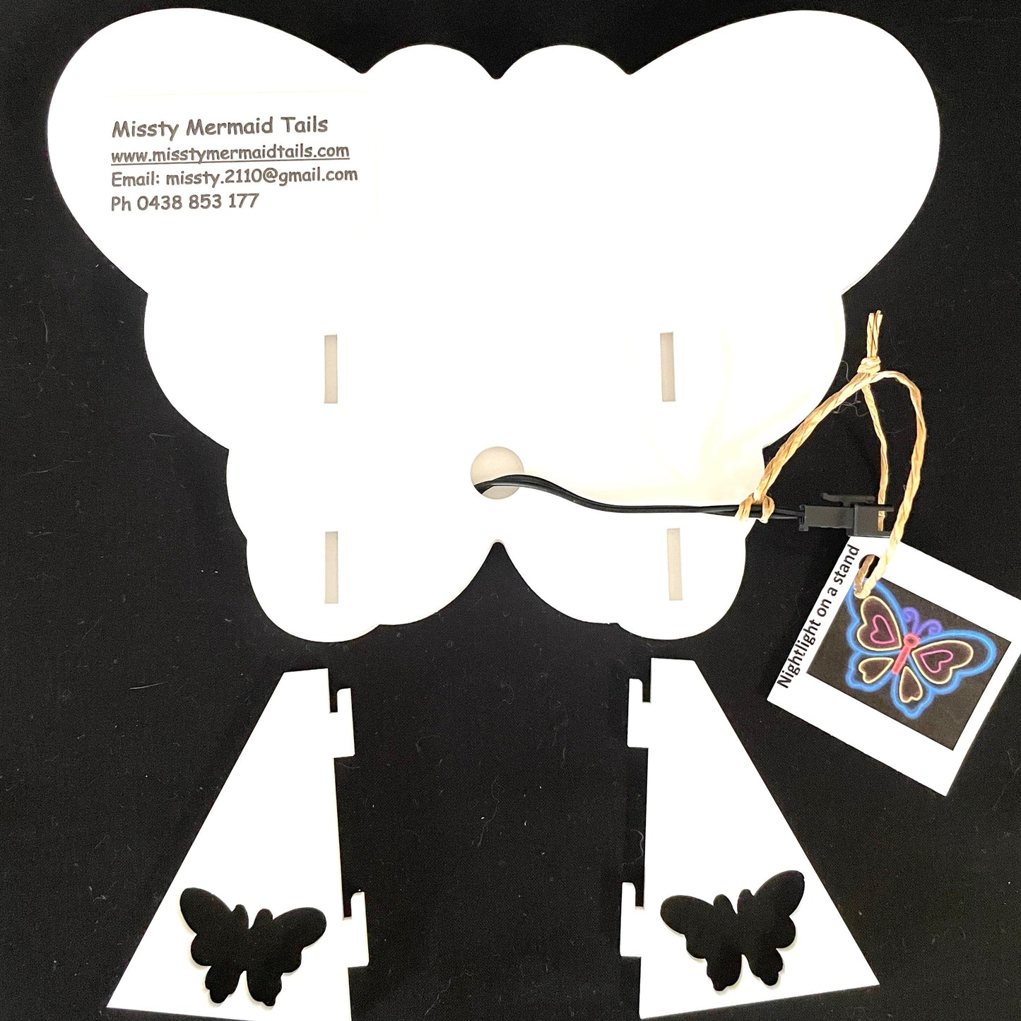 Back view of butterfly neon light showing how the stands attach