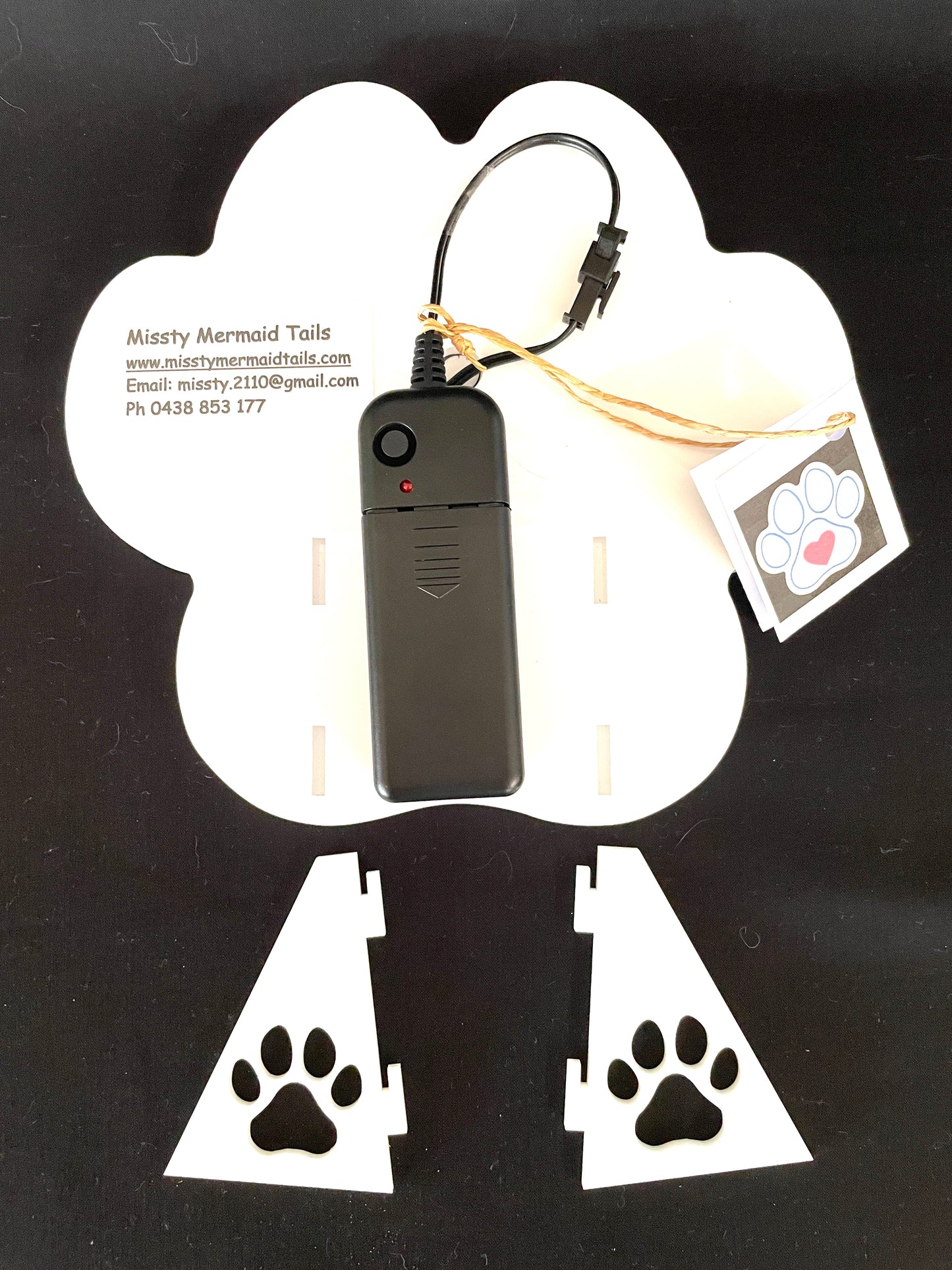 Back view of paw print neon light showing how the stands attach