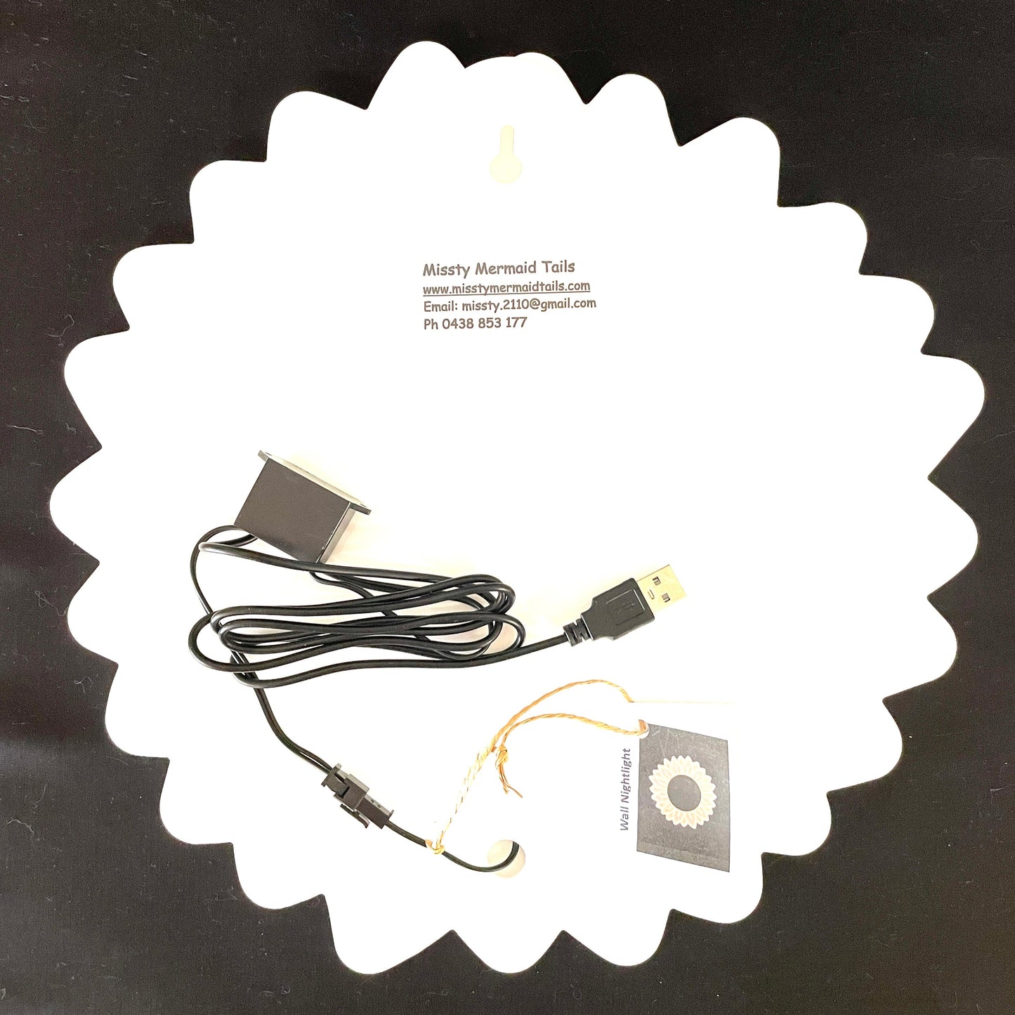 Back view of sunflower neon light with a USB lead