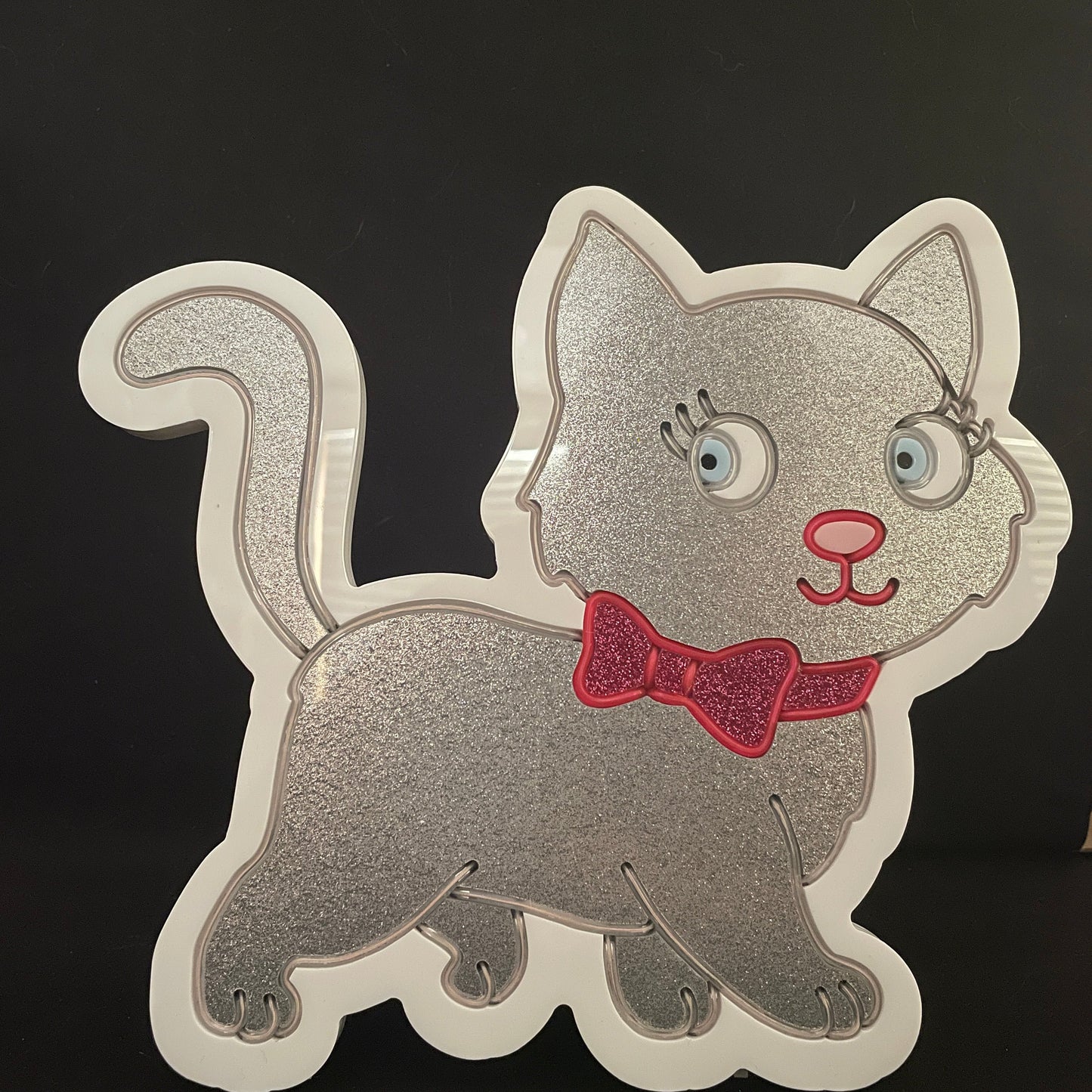 Silver cat with white EL wire and a pink bow neon light not lit up