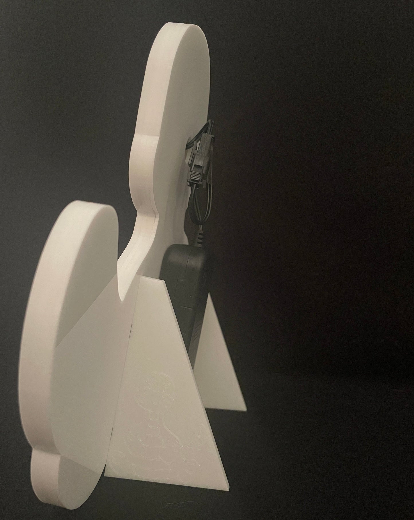 Side view of baby dinosaur neon light