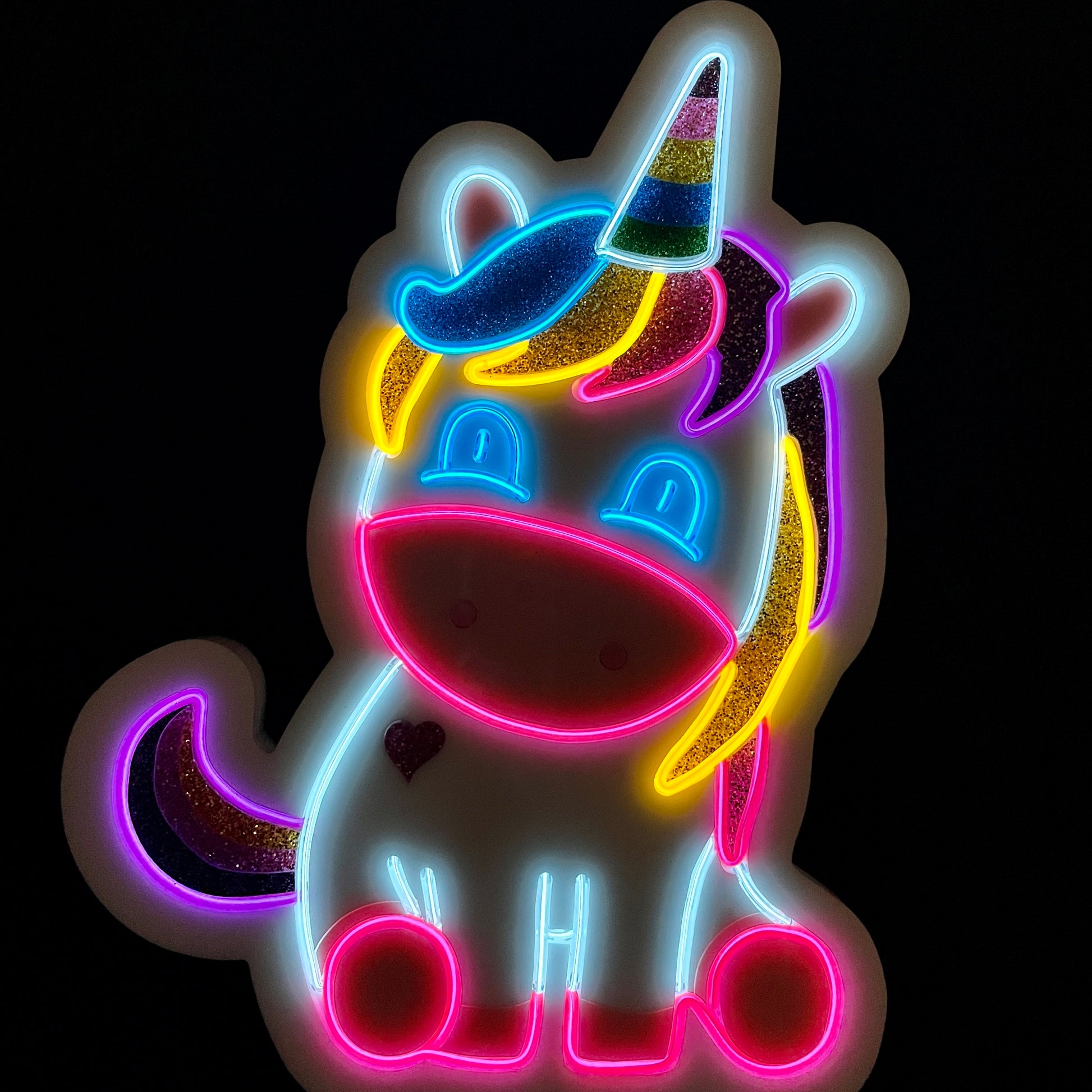 Baby unicorn with rainbow mane, tail and horn neon light