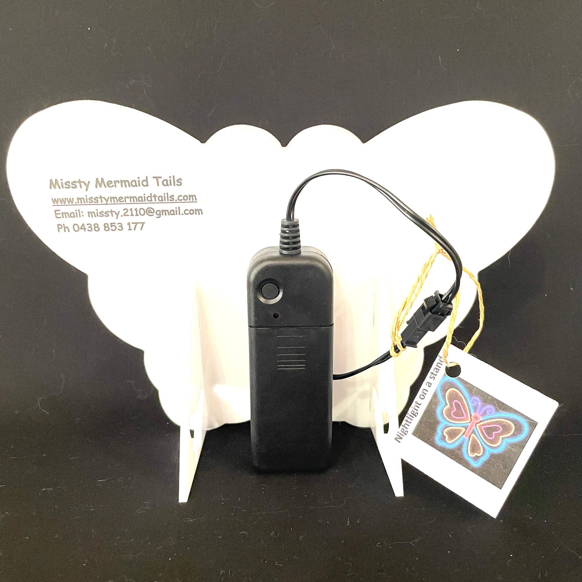 Back view of butterfly neon light with battery pack