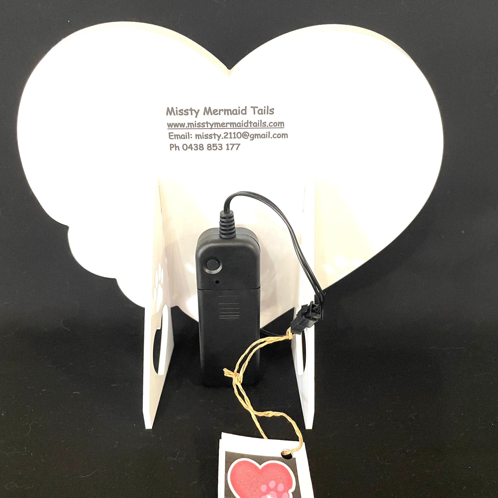 Back view of heart with paw print neon light with battery pack