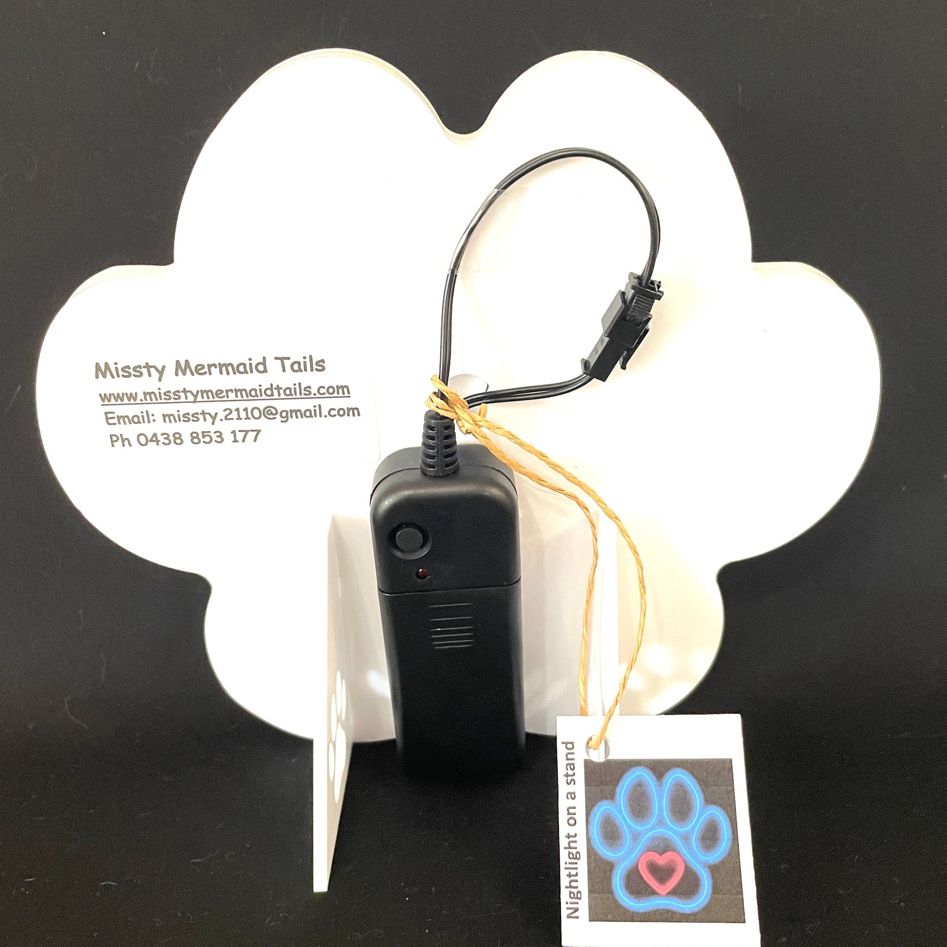 Back view of paw print neon light with a battery pack