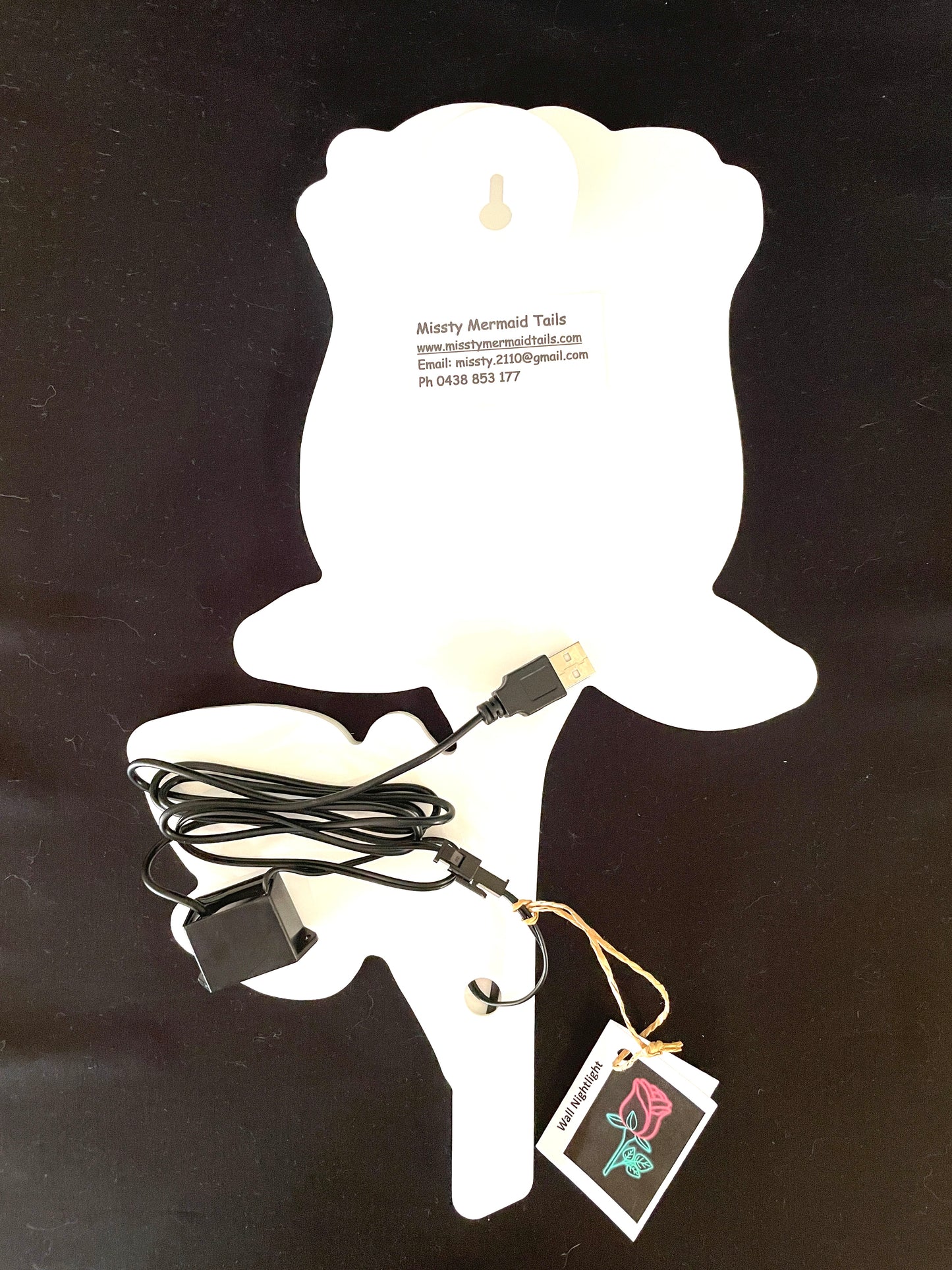 Back view of rose neon light with a USB lead