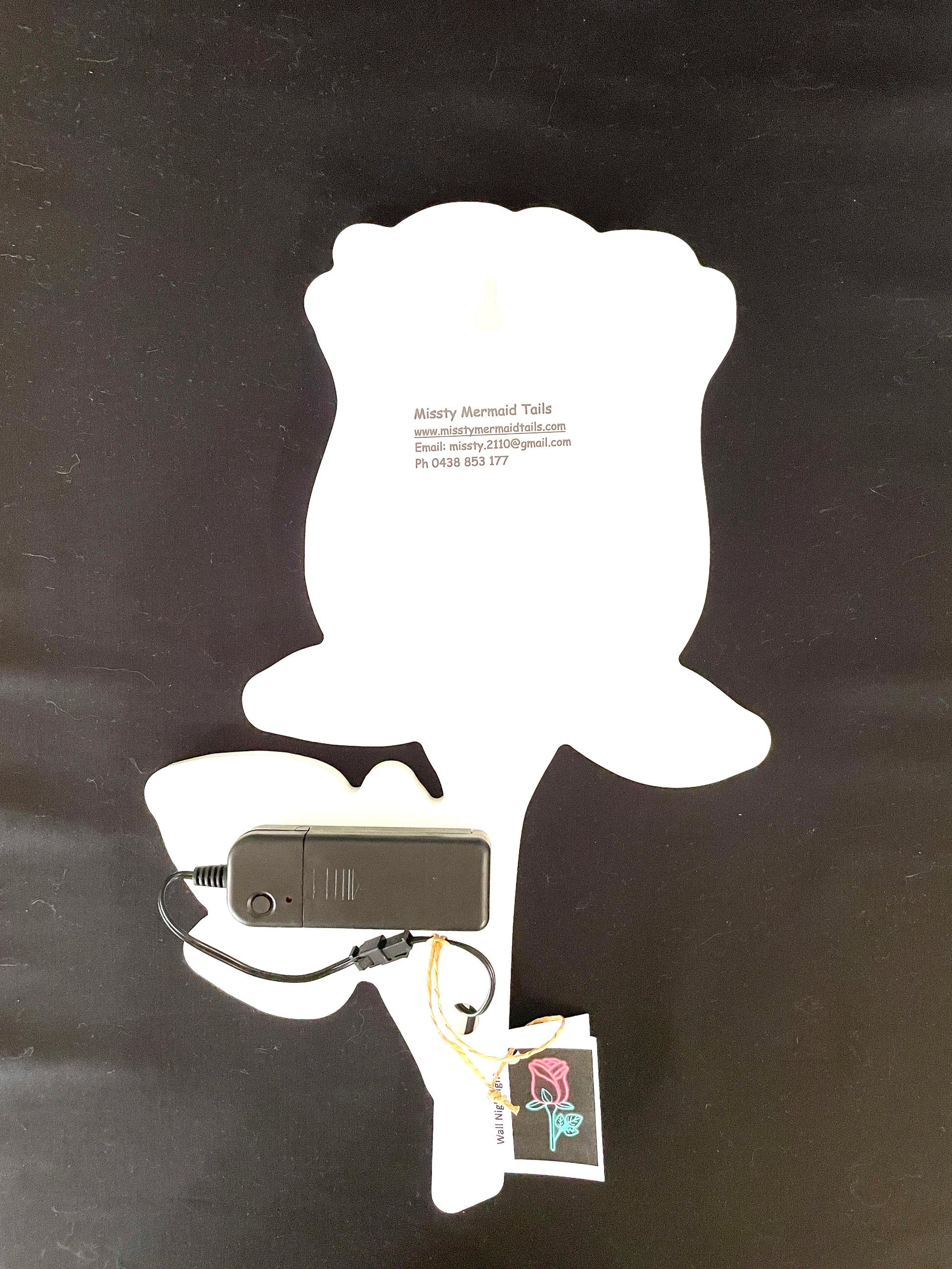 Back view of rose neon light with a battery pack