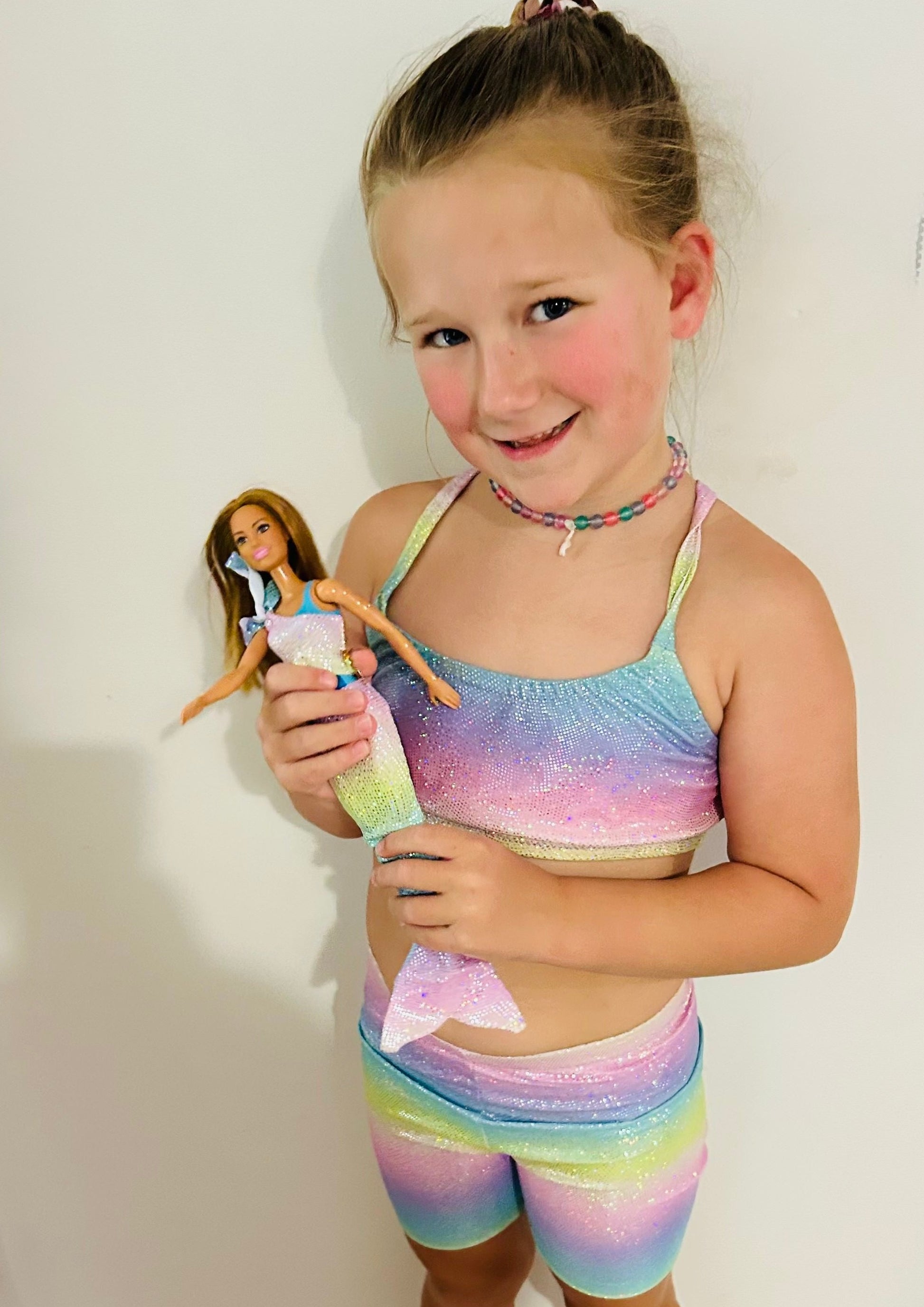 Girl wearing pastel rainbow crop top and matching shorts gymnastic outfit (2) Brisbane Australia