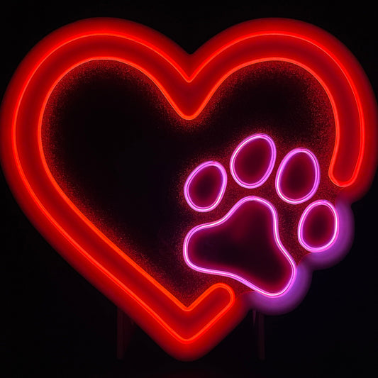Red heart with a pink paw print neon light displayed lit up