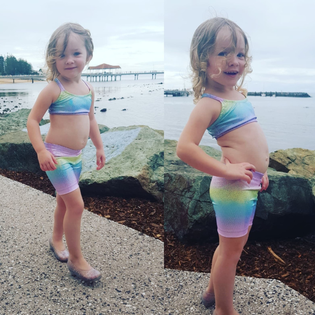 Girl wearing pastel rainbow gymnastic outfit Brisbane Australia
